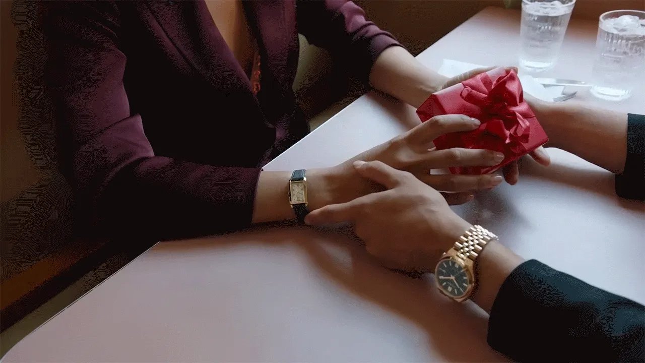 Animated clip of two people with a gift box