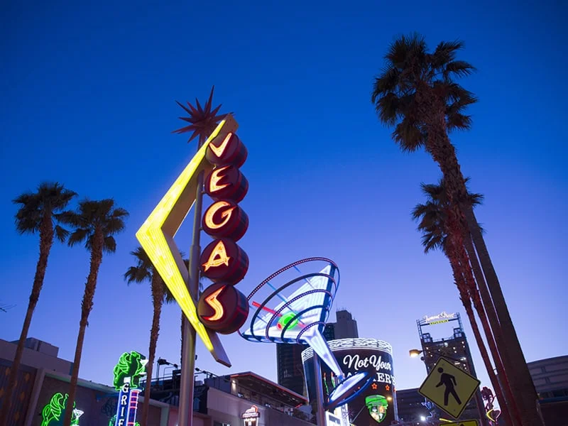 Old retro style neon signs promoting Fremont street gambling.