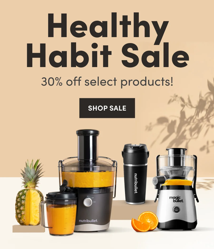Group of nutribullet appliances displayed with pineapple and oranges for the Healthy Habit Sale