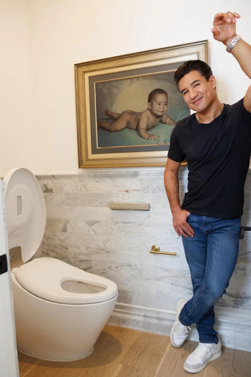 Mario Lopez poses in his bathroom next to his NEOREST NX2