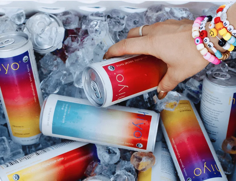 (image of a hand reaching in to a cooler grabbing cans.)