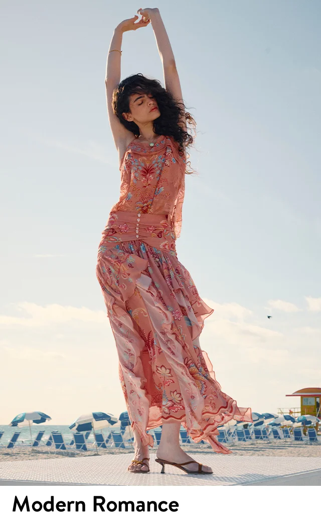 A woman wearing a floral-print maxi dress.
