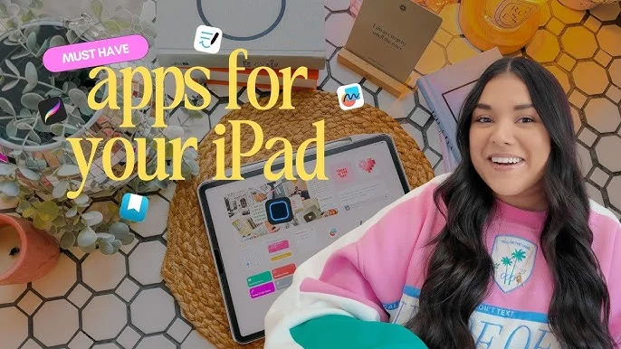 A woman sits in front of a desk with an iPad and other accessories, with the words “Must have apps for your iPad” in front.