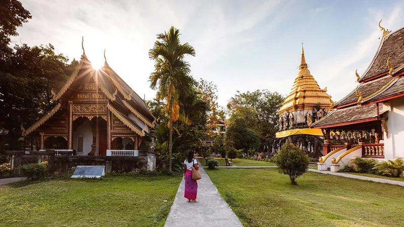 Image description: Solo traveler at Wat Chiang Man, Chiang Mai, Thailand.