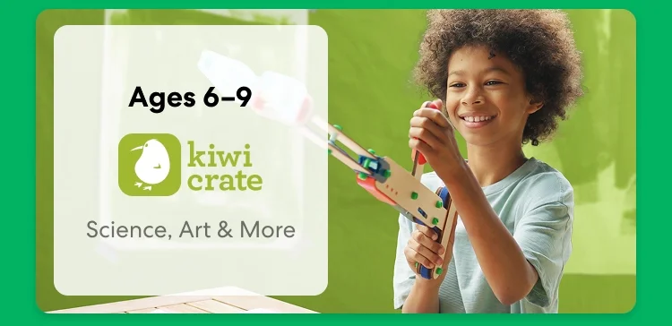 Young child smiling while working on a science experiment from KiwiCo Labs. Hands-on STEM learning for ages 6–9