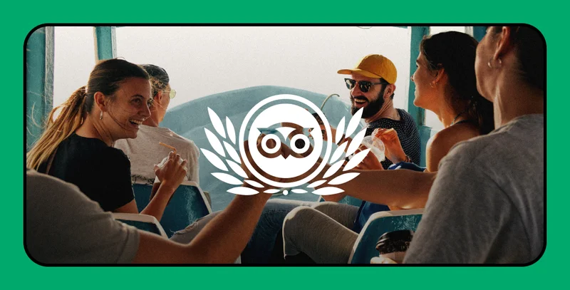 Image description: Photo of people seated laughing and talking with large Travelers’ Choice logo watermark across the image.