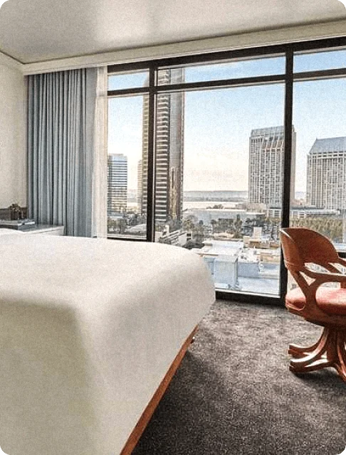 Image Description: A luxurious suite at Pendry San Diego with a sprawling view of the city