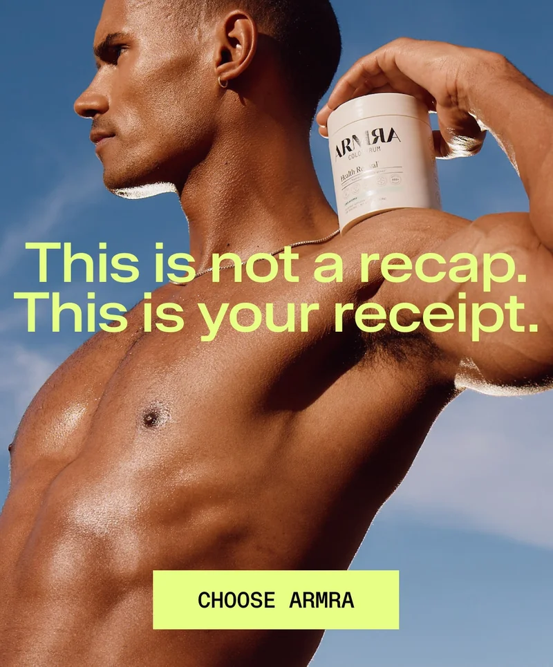 Shirtless man holding an ARMRA Colostrum container on his shoulder under a blue sky, with headline text overlay.