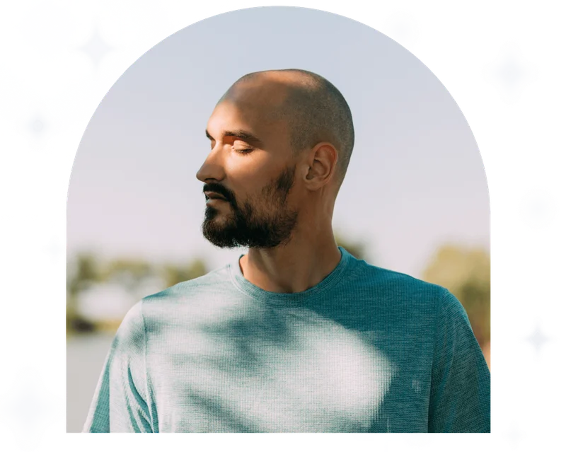 Portrait of a young man on a blue sky background.