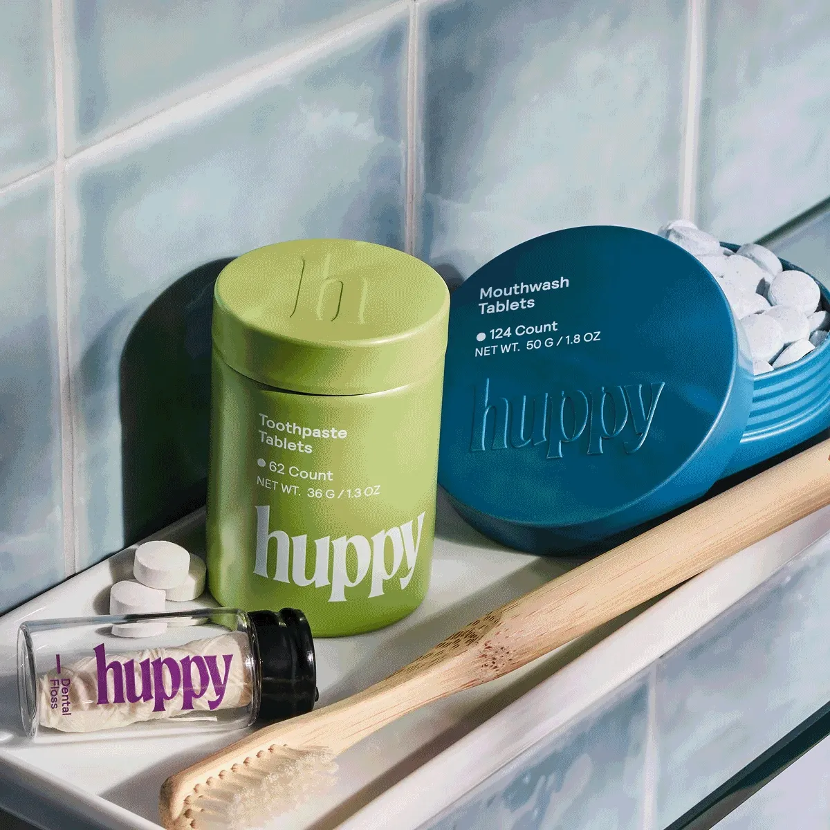 A collection of four images that show the solid tin containers, toothpaste tabs, smiling person, and hands holding bright tins