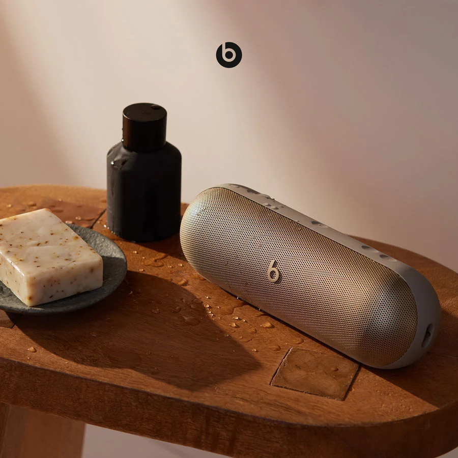 Beats Pill sitting on a bath stool showcasing it's water-resistant feature