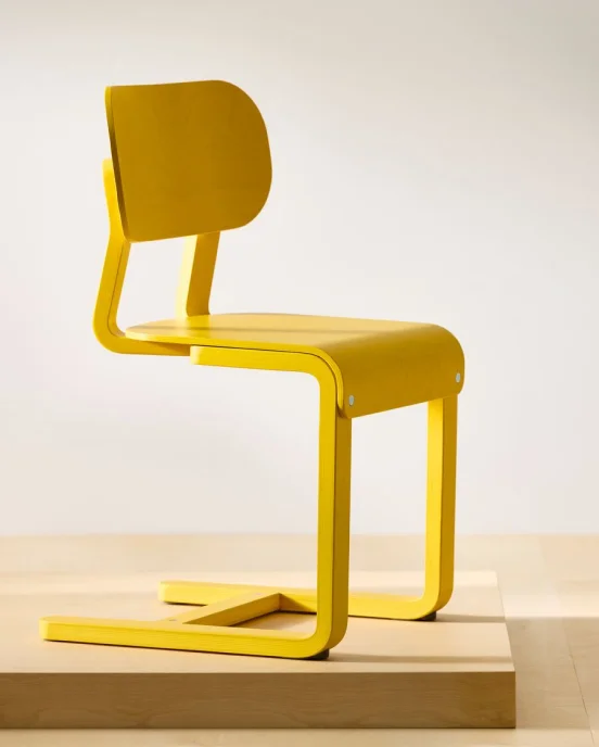 A yellow LYCKAN chair.
