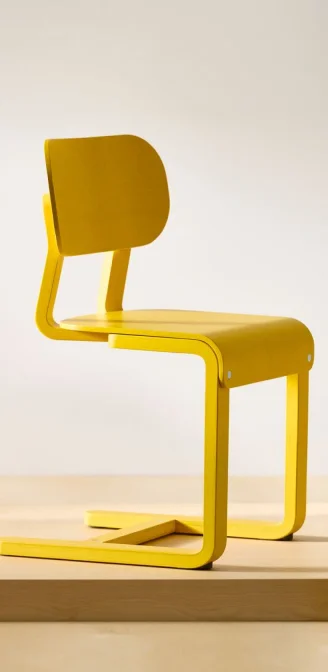 A yellow LYCKAN chair.