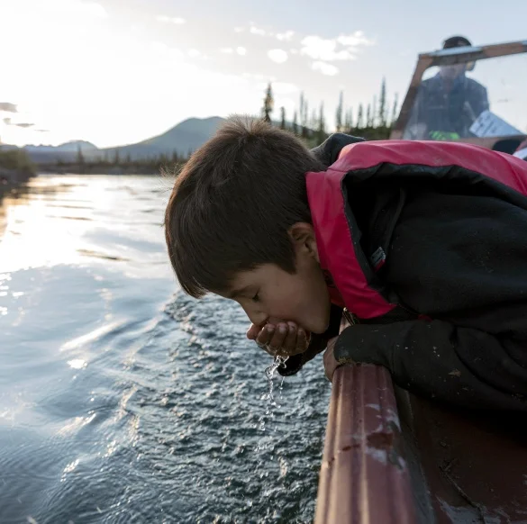 A person drinking water.