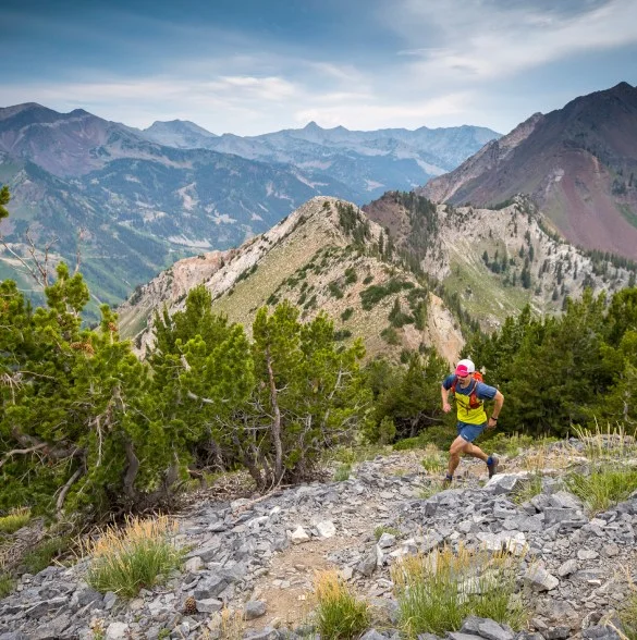 A person running in the mountains.