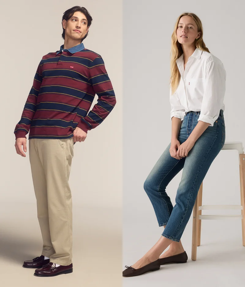 Man wearing a blue, red, yellow striped shirt and khakis. Woman wearing a white button up and blue jeans.