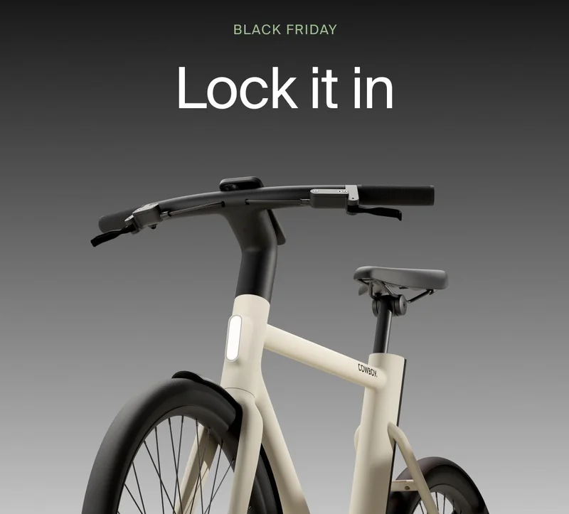 A graphic. Black Friday Cowboy promotion with a rendered e-bike offering €1000 off. Available on top-spec models.