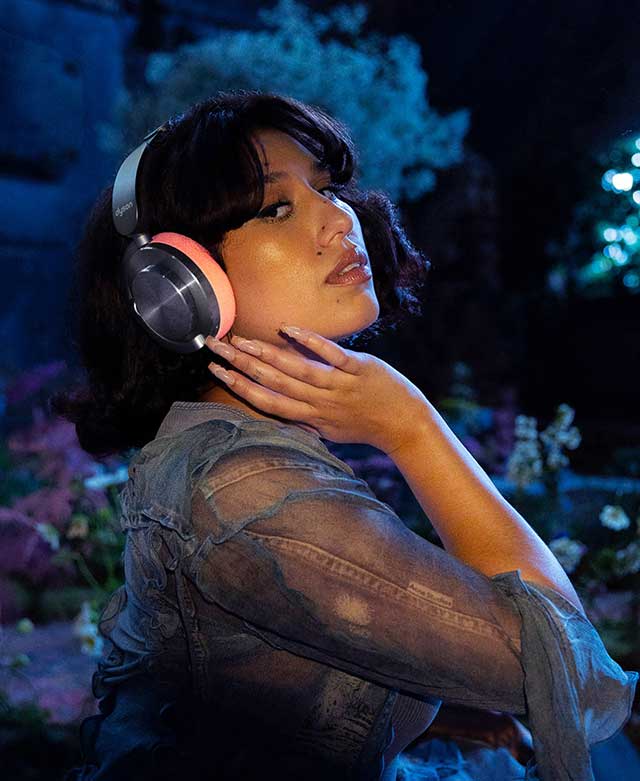 RAYE with Dyson OnTrac headphones.