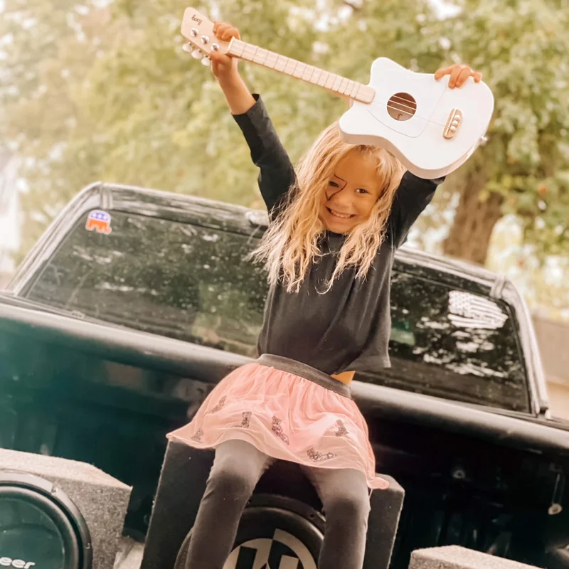 Girl holding a guitar