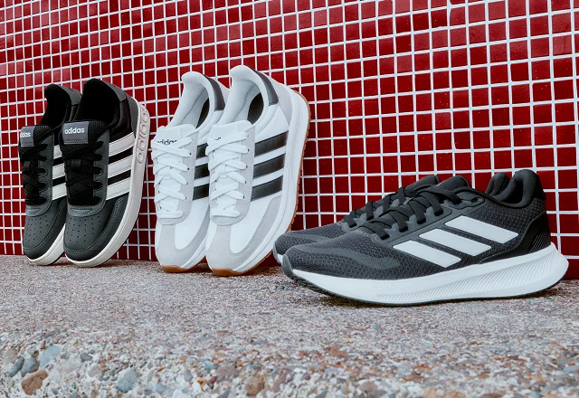 Three pairs of adidas shoes