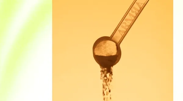 Gif of powder flowing out of a scoop