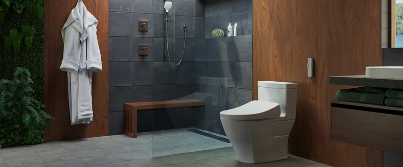 A TOTO WASHLET bidet seat sits in a luxury bathroom