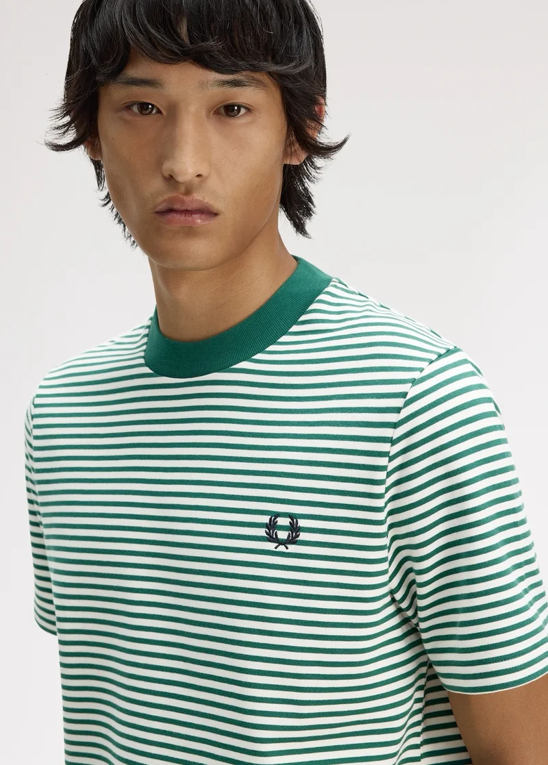 Male model wearing a Fred Perry Fine Stripe Heavyweight T-shirt in Sport Green