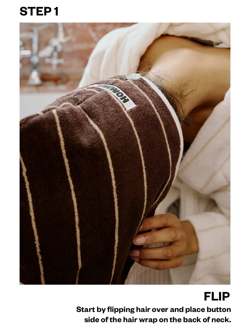 STEP 1 (FLIP): Start by flipping hair over and place button side of the hair wrap on the back of neck.