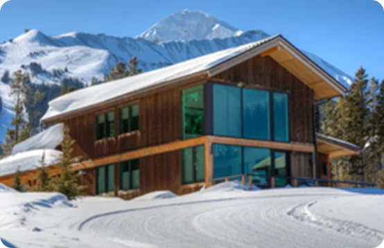 Relax in a modern alpine retreat framed by towering peaks and fresh powder in Big Sky, Montana.