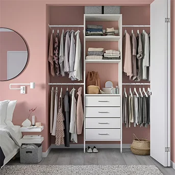 White open-concept AURDAL wardrobe against pink wall