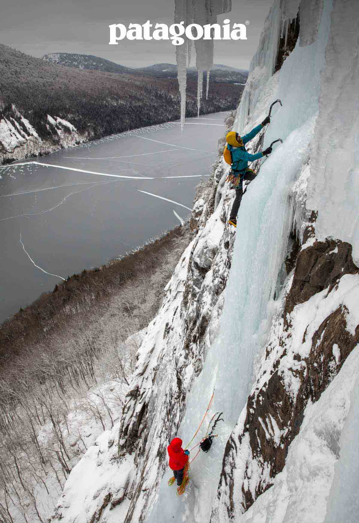 Patagonia. Two ice climbers on a route above a frozen lake.