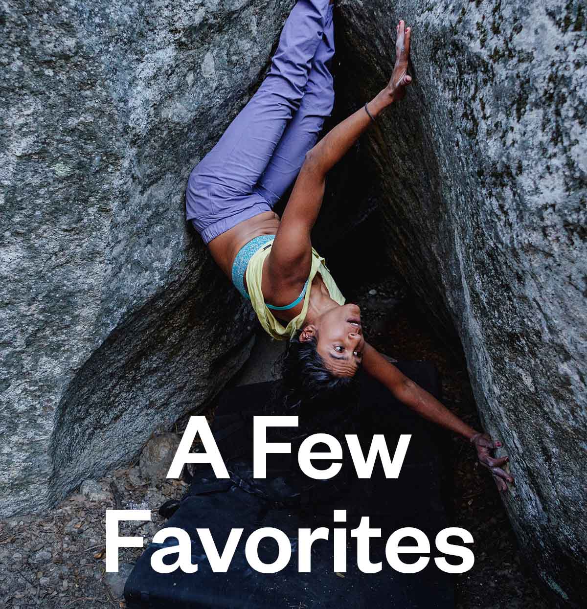 A climber rests while upside down on a bouldering problem at Camp 4 in Yosemite National Park.