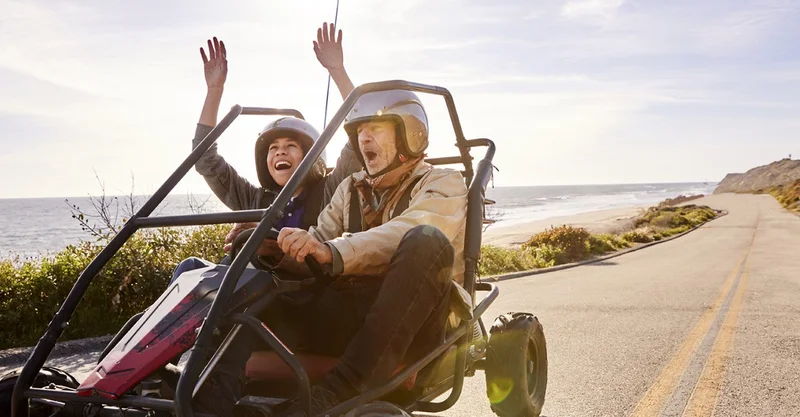 Man and woman riding in cart