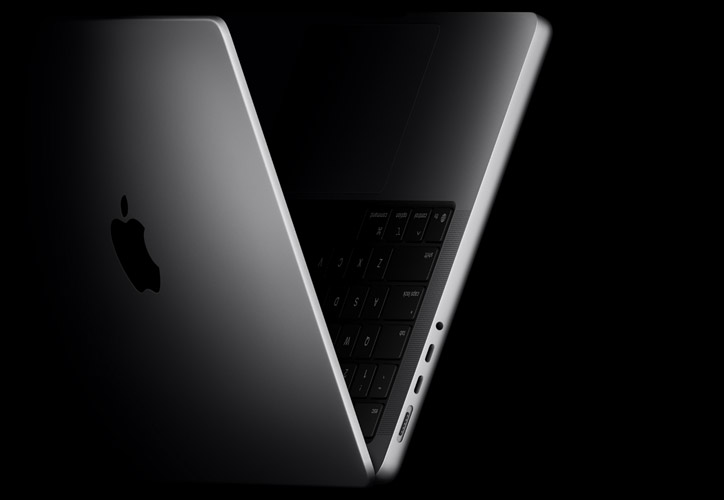 14-inch MacBook Pro laptop, side exterior revealing thinness and side ports, space black color