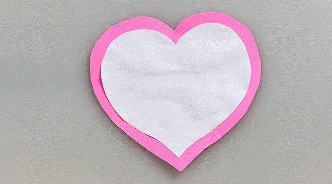 Hands painting a heart-shaped paper flower with “I ❤️ U” message (GIF)