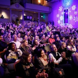 A theater full of moviegoers celebrating a Sundance Film Festival film.
