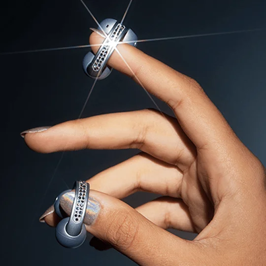 The moto buds loop on the someone's fingertips