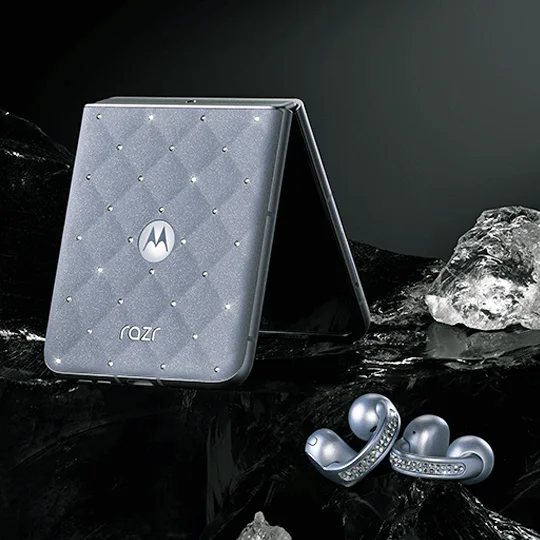 The new motorola razr Swarovski® edition and moto buds loop sitting on a table