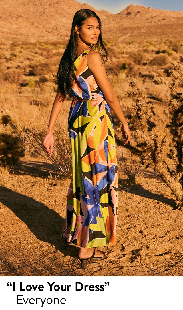 Woman wearing a floral-print maxi dress.