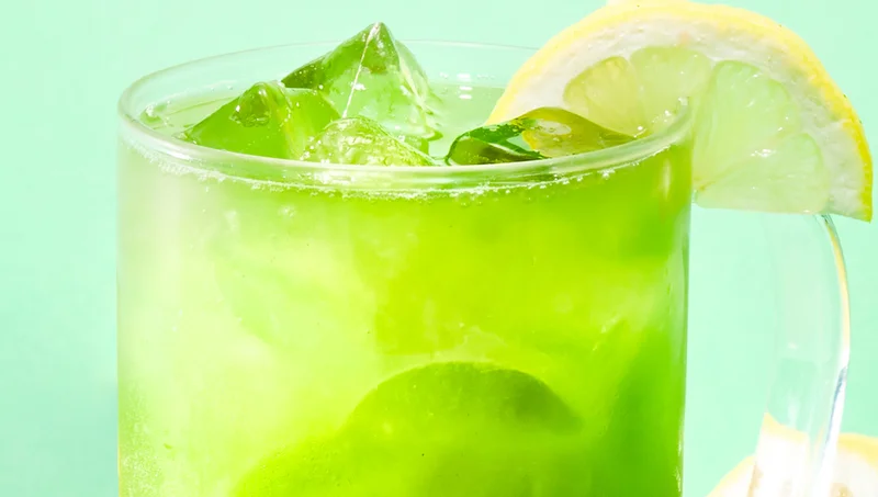 Fill a tall glass with ice then pour matcha - Top with 8 oz tonic water