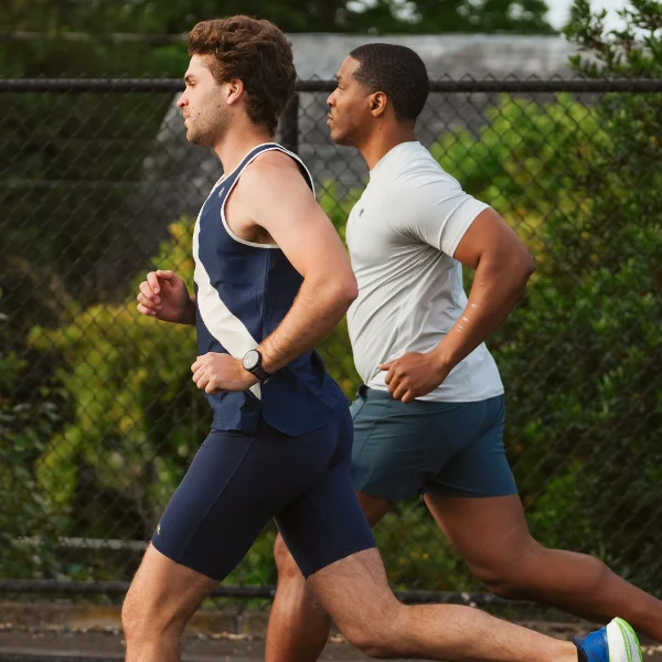 Two men running together