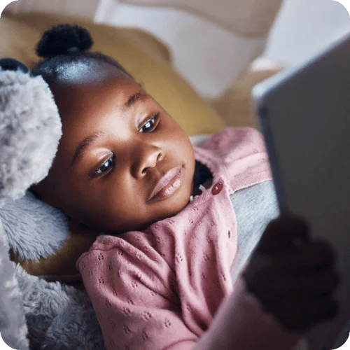 a little girl using an ipad who will surely have a meltdown when time is up a little girl using an ipad who will surely have a meltdown when time is up