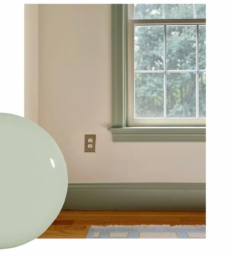 Window trim and baseboard painted in soft olive green paint color Dirty Martini