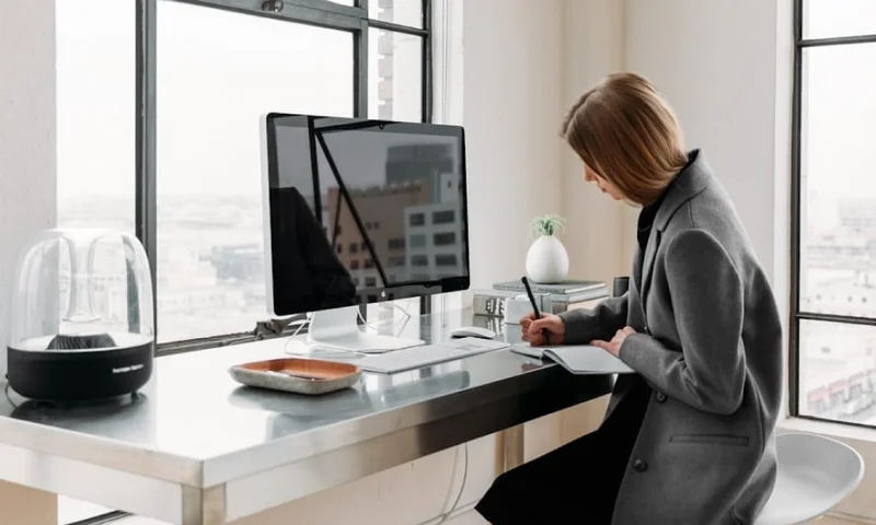 Image of a woman working at a desk