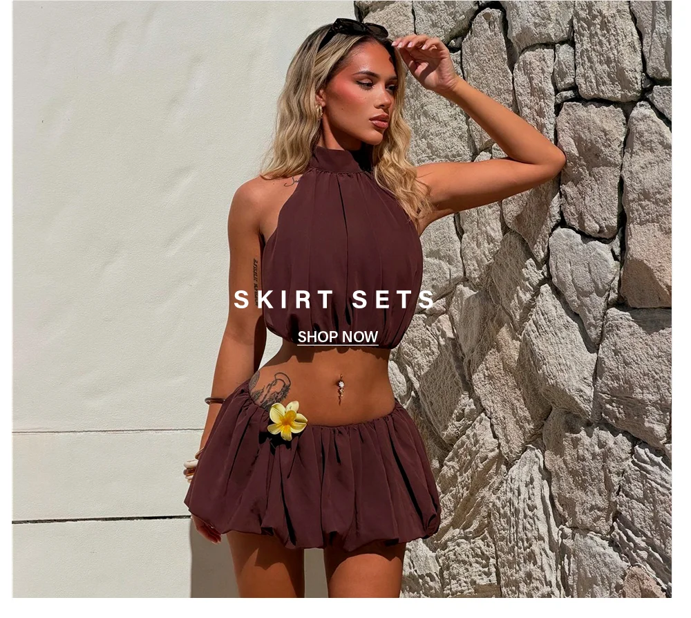 Brown halter crop top and bubble mini skirt set with flower detail. Shop women's trendy skirt sets.