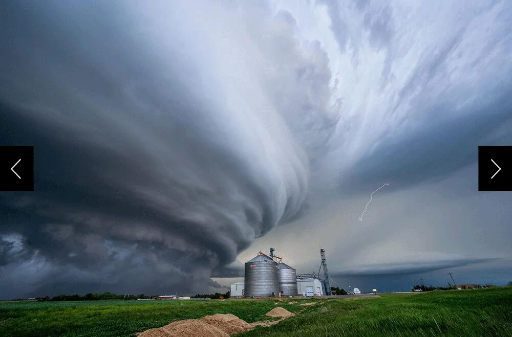 storm swirling over farm elevator