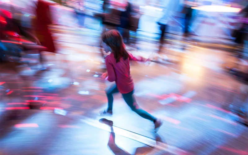 A young girl is pictured running in a blur.