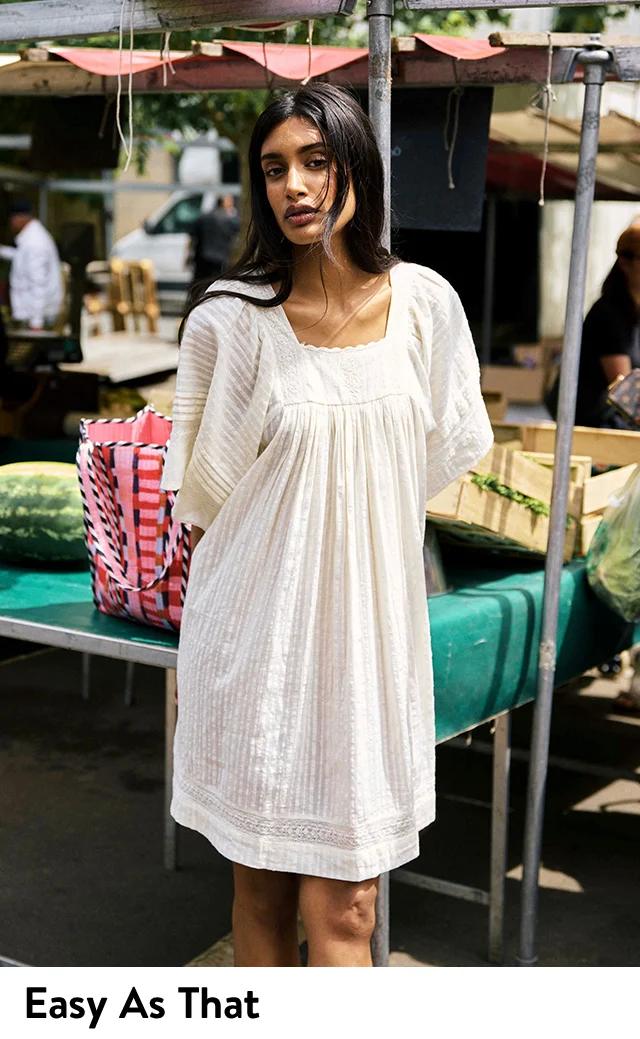 A woman wearing a white dress.