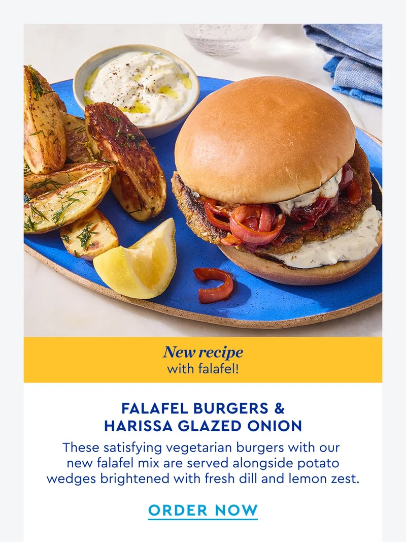 New Recipe with falafel! Falafel burgers with harissa glazed onion - These satisfying vegetarian burgers with our new falafel mix are served alongside potato wedges brightened with fresh dill and lemon zest. | ORDER NOW