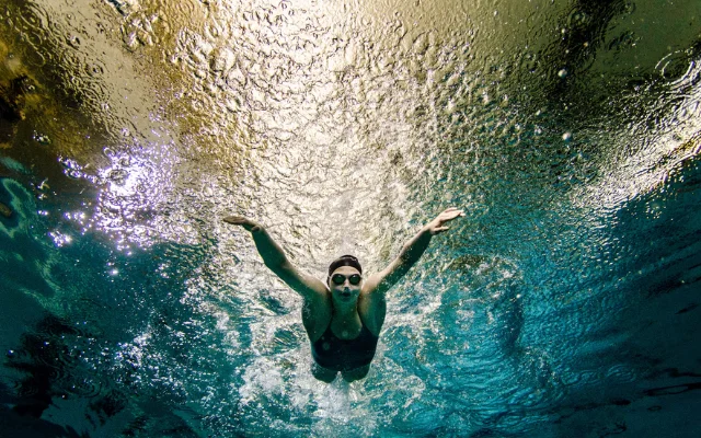 A person swimming underwater